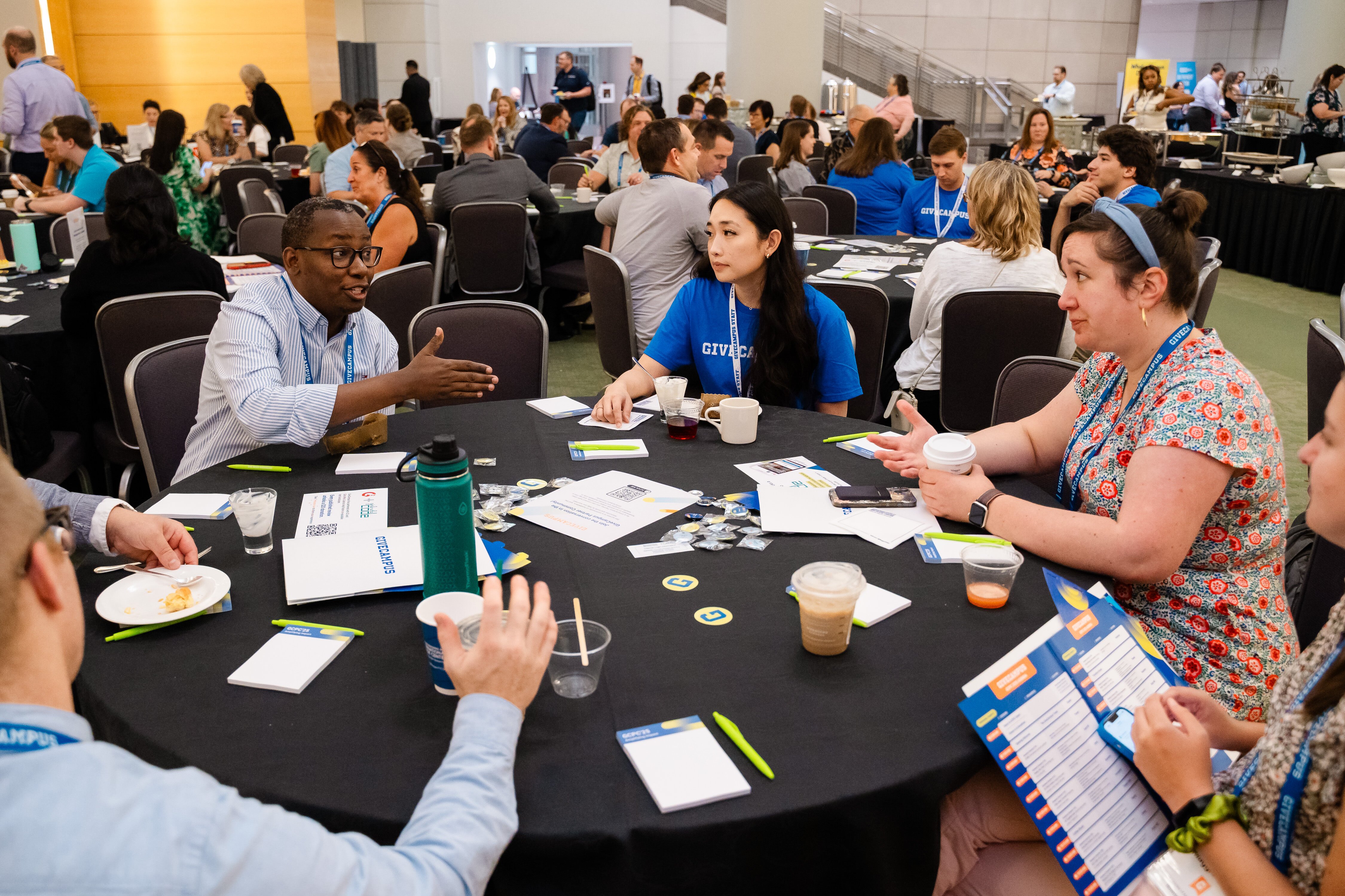 Attendees networking at round tables